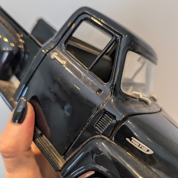 Classic Black Toy Truck with Red Wheels - Picture 6 of 11